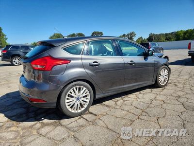 Trzecie zdjęcie samochodu z tyłu: 2016 FORD FOCUS TITANIUM VIN:1FADP3N27GL253226 - miniatura