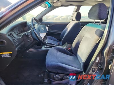 Zdjęcie 7 z 12 samochodu: 2003 HYUNDAI SONATA BASE VIN:KMHWF25SX3A787788 - miniatura