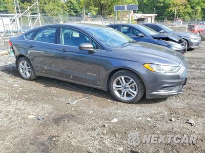 Czwarte zdjęcie samochodu z boku: 2018 FORD FUSION SE HYBRID VIN:3FA6P0LU5JR115477 - miniatura