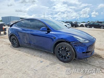 Czwarte zdjęcie samochodu z boku: 2023 TESLA MODEL Y VIN:7SAYGDEE5PA100262 - miniatura