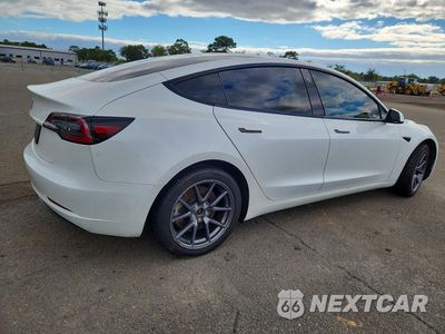 Trzecie zdjęcie samochodu z tyłu: 2023 TESLA MODEL 3 VIN:5YJ3E1EA8PF555540 - miniatura