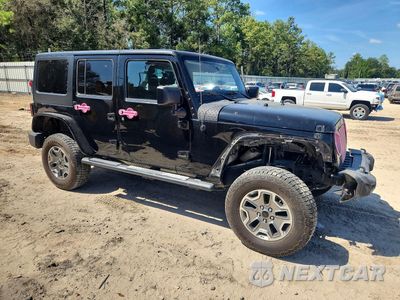 Czwarte zdjęcie samochodu z boku: 2015 JEEP WRANGLER UNLIMITED SPORT VIN:1C4BJWDG1FL762468 - miniatura