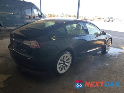Trzecie zdjęcie samochodu z tyłu: 2022 TESLA MODEL 3 VIN:5YJ3E1EBXNF290576 - miniatura