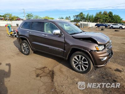 Czwarte zdjęcie samochodu z boku: 2017 JEEP GRAND CHEROKEE OVERLAND VIN:1C4RJFCG1HC738948 - miniatura