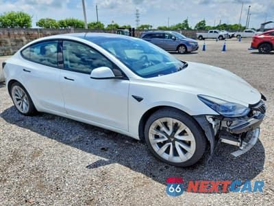 Czwarte zdjęcie samochodu z boku: 2022 TESLA MODEL 3 VIN:5YJ3E1EA2NF287324 - miniatura