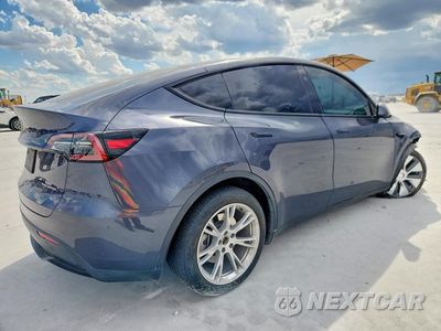 Trzecie zdjęcie samochodu z tyłu: 2023 TESLA MODEL Y VIN:7SAYGDEE9PA168192 - miniatura
