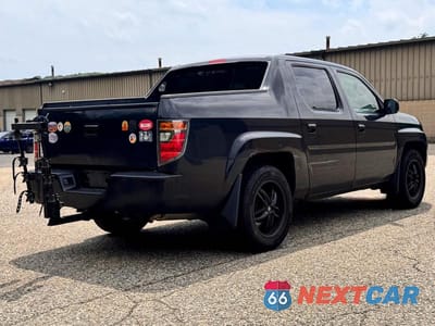 Czwarte zdjęcie samochodu z boku: 2006 HONDA RIDGELINE RTL VIN:2HJYK16596H555521 - miniatura