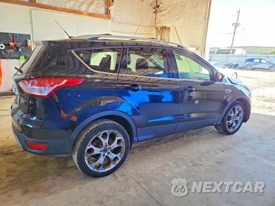 Trzecie zdjęcie samochodu z tyłu: 2016 FORD ESCAPE TITANIUM VIN:1FMCU9J96GUB05594 - miniatura