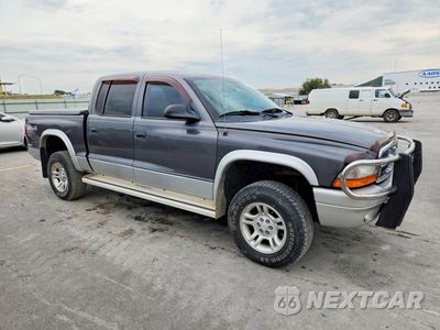 Czwarte zdjęcie samochodu z boku: 2003 DODGE DAKOTA QUAD SLT VIN:1D7HG48N83S324978 - miniatura
