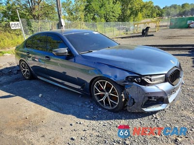 Czwarte zdjęcie samochodu z boku: 2023 BMW M550XI VIN:WBA13BK03PCM16571 - miniatura
