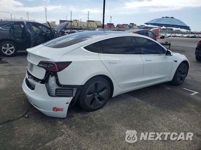 Trzecie zdjęcie samochodu z tyłu: 2018 TESLA MODEL 3 VIN:5YJ3E1EA4JF057469 - miniatura