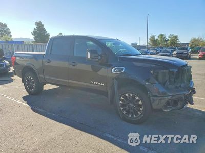 Czwarte zdjęcie samochodu z boku: 2017 NISSAN TITAN PRO-4X VIN:1N6AA1E50HN551102 - miniatura
