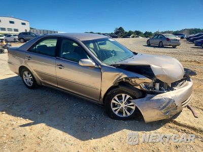 Czwarte zdjęcie samochodu z boku: 2004 TOYOTA CAMRY LE V6 VIN:4T1BF32K44U066570 - miniatura
