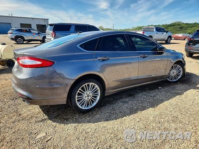 Trzecie zdjęcie samochodu z tyłu: 2014 FORD FUSION SE HYBRID VIN:3FA6P0LU1ER195009 - miniatura