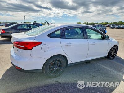 Trzecie zdjęcie samochodu z tyłu: 2016 FORD FOCUS SE VIN:1FADP3F21GL223654 - miniatura