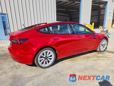 Trzecie zdjęcie samochodu z tyłu: 2022 TESLA MODEL 3 VIN:5YJ3E1EA4NF303782 - miniatura