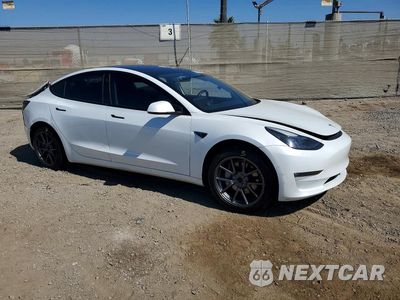 Czwarte zdjęcie samochodu z boku: 2021 TESLA MODEL 3 VIN:5YJ3E1EB4MF872591 - miniatura