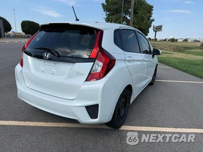 Czwarte zdjęcie samochodu z boku: 2015 HONDA FIT LX VIN:3HGGK5G56FM728615 - miniatura