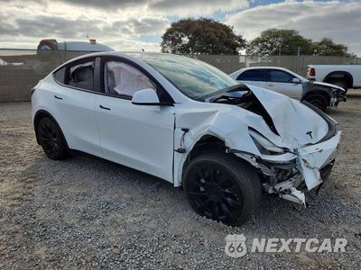Czwarte zdjęcie samochodu z boku: 2021 TESLA MODEL Y VIN:5YJYGDEE3MF282829 - miniatura