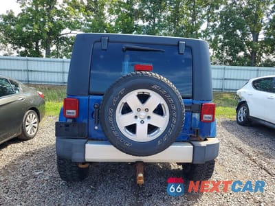 Zdjęcie 6 z 13 samochodu: 2010 JEEP WRANGLER UNLIMITED SAHARA VIN:1J4BA5H14AL122645 - miniatura
