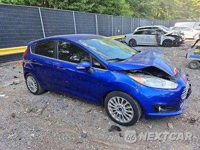 Czwarte zdjęcie samochodu z boku: 2014 FORD FIESTA TITANIUM VIN:3FADP4FJ0EM226215 - miniatura