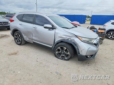 Czwarte zdjęcie samochodu z boku: 2017 HONDA CR-V TOURING VIN:2HKRW2H91HH615630 - miniatura