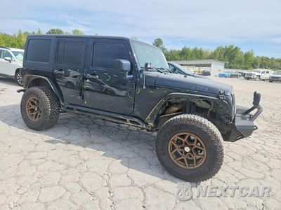 Czwarte zdjęcie samochodu z boku: 2014 JEEP WRANGLER UNLIMITED RUBICON VIN:1C4BJWFG5EL279948 - miniatura