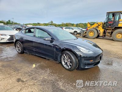 Czwarte zdjęcie samochodu z boku: 2021 TESLA MODEL 3 VIN:5YJ3E1EA7MF853959 - miniatura