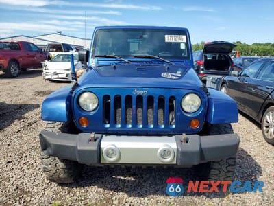 Piąte zdjęcie samochodu w środku: 2010 JEEP WRANGLER UNLIMITED SAHARA VIN:1J4BA5H14AL122645 - miniatura
