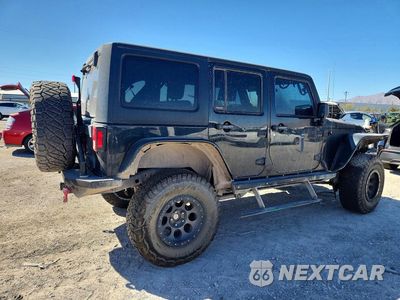 Trzecie zdjęcie samochodu z tyłu: 2010 JEEP WRANGLER UNLIMITED RUBICON VIN:1J4BA6H14AL166988 - miniatura