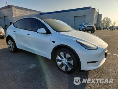 Czwarte zdjęcie samochodu z boku: 2023 TESLA MODEL Y VIN:7SAYGDEE6PA148353 - miniatura