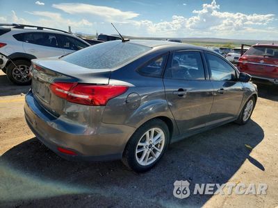 Trzecie zdjęcie samochodu z tyłu: 2017 FORD FOCUS SE VIN:1FADP3F21HL328924 - miniatura