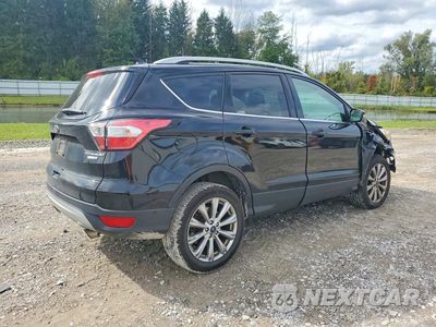 Trzecie zdjęcie samochodu z tyłu: 2018 FORD ESCAPE TITANIUM VIN:1FMCU9J99JUC00593 - miniatura