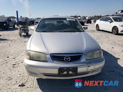 Piąte zdjęcie samochodu w środku: 2002 MAZDA 626 LX VIN:1YVGF22C125296145 - miniatura