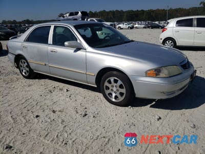 Czwarte zdjęcie samochodu z boku: 2002 MAZDA 626 LX VIN:1YVGF22C125296145 - miniatura