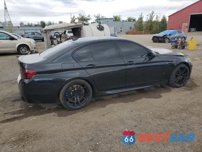 Trzecie zdjęcie samochodu z tyłu: 2013 BMW M5 VIN:WBSFV9C52DD097006 - miniatura
