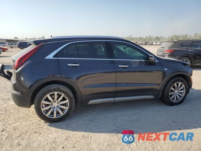 Trzecie zdjęcie samochodu z tyłu: 2022 CADILLAC XT4 PREMIUM LUXURY VIN:1GYFZCR44NF151123 - miniatura