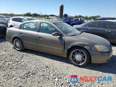 Czwarte zdjęcie samochodu z boku: 2002 NISSAN ALTIMA BASE VIN:1N4AL11DX2C173132 - miniatura