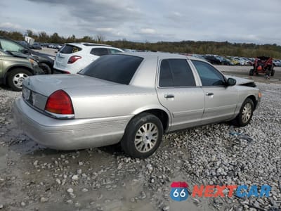 Trzecie zdjęcie samochodu z tyłu: 2003 FORD CROWN VICTORIA LX VIN:2FAFP74W33X220077 - miniatura