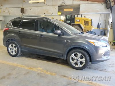 Czwarte zdjęcie samochodu z boku: 2016 FORD ESCAPE SE VIN:1FMCU0GX1GUA60078 - miniatura