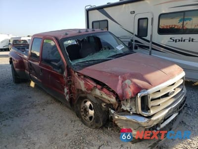 Czwarte zdjęcie samochodu z boku: 2002 FORD F350 SUPER DUTY VIN:1FTWW32F52EA95737 - miniatura