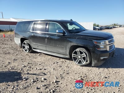 Czwarte zdjęcie samochodu z boku: 2015 CHEVROLET SUBURBAN K1500 LTZ VIN:1GNSKKKC0FR641666 - miniatura
