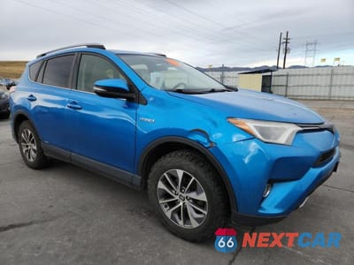 Czwarte zdjęcie samochodu z boku: 2018 TOYOTA RAV4 HV VIN:JTMRJREV2JD187989 - miniatura