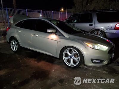Czwarte zdjęcie samochodu z boku: 2015 FORD FOCUS TITANIUM VIN:1FADP3J23FL269749 - miniatura