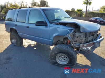 Czwarte zdjęcie samochodu z boku: 1995 CHEVROLET TAHOE K1500 VIN:1GNEK13K3SJ441600 - miniatura