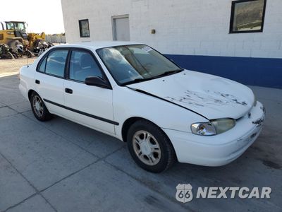 Czwarte zdjęcie samochodu z boku: 1999 CHEVROLET GEO PRIZM BASE VIN:1Y1SK5480XZ413327 - miniatura