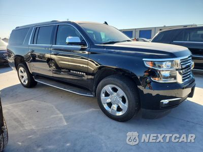Czwarte zdjęcie samochodu z boku: 2020 CHEVROLET SUBURBAN C1500 PREMIER VIN:1GNSCJKC0LR102645 - miniatura