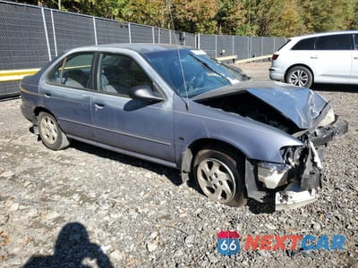 Czwarte zdjęcie samochodu z boku: 1999 NISSAN SENTRA BASE VIN:3N1AB41D9XL076033 - miniatura