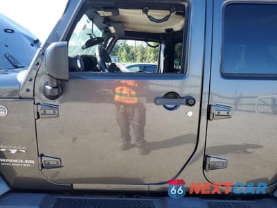 Zdjęcie 7 z 11 samochodu: 2016 JEEP WRANGLER UNLIMITED SAHARA VIN:1C4BJWEG3GL268452 - miniatura