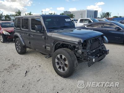 Czwarte zdjęcie samochodu z boku: 2019 JEEP WRANGLER UNLIMITED SAHARA VIN:1C4HJXENXKW664903 - miniatura